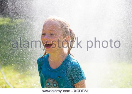 Young Girl In Wet T-shirt Resting On The Seashore Stock Photo: 37818586 