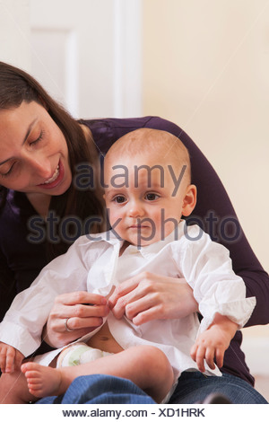 changing mother clothes son bavaria munich germany bedroom cute alamy