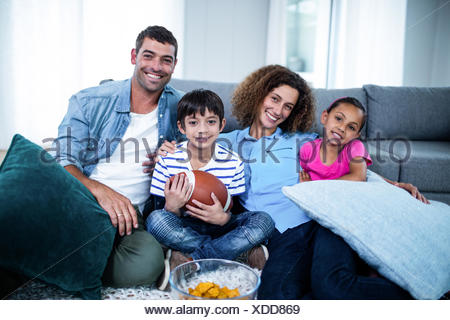 portrait of a young boy watching football on television Stock Photo - Alamy