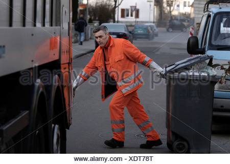 Garbage Collector For The Stuttgart Garbage Company Called Aws Or Abfallwirtschaft Stuttgart Pulling A Garbage Container Behi Stock Photo Alamy