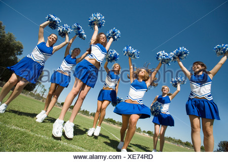 Cheerleaders with pom poms jumping Stock Photo: 14577014 - Alamy