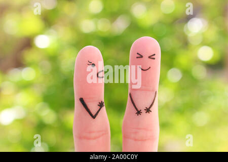 Finger Kunst der Familie während der Streit. Konzept der Frau ruft auf Mann, Mann lacht. Stockfoto