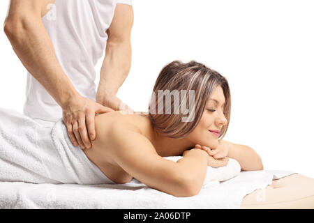 Entspannt junge Frau eine Massage auf ihrem Rücken isoliert auf weißem Hintergrund Stockfoto