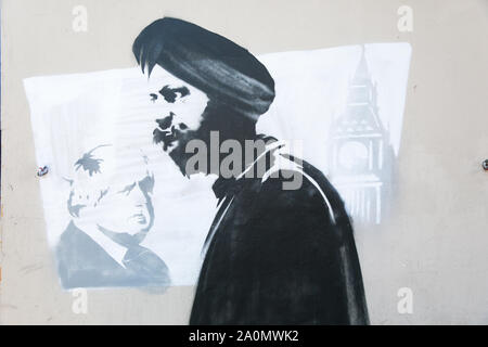 Tanmanjeet Singh Dhesi erscheint in einem Street Graffiti Wandbild, Soho Road, Handsworth, Birmingham, Großbritannien. Das wandbild zeigt die Auseinandersetzung Tan Dhesi mit PM Boris Johnson Sept. 2019 im Unterhaus hatte Stockfoto