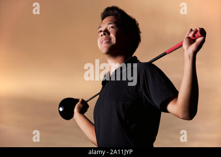 Golfspieler Portrait bei Sonnenuntergang. Stockfoto