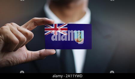 Geschäftsmann Holding Karte von Montserrat Flagge Stockfoto