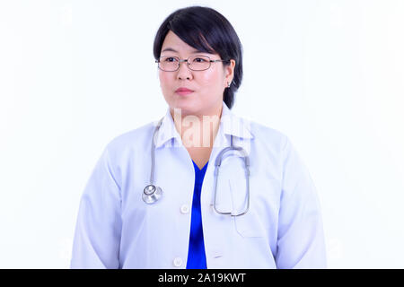 Angesichts des schönen Übergewicht asiatische Frau Doktor denken Stockfoto