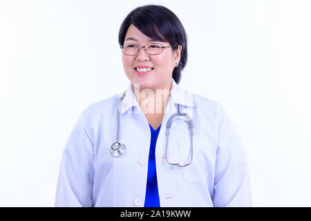 Angesichts der glücklichen Übergewicht asiatische Frau Doktor denken Stockfoto