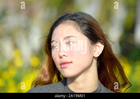 Eine junge asiatische Frau und Langeweile Stockfoto