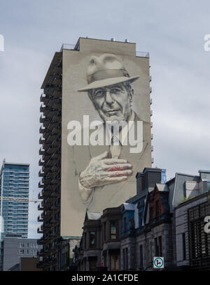 Ein wandbild von Leonard Cohen auf einem Gebäude in der Nähe der Innenstadt von Montreal, Kanada. Beachten Sie die roten emminating aus seinem Herzen. Stockfoto