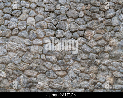 Natursteinmauer Textur. Stockfoto