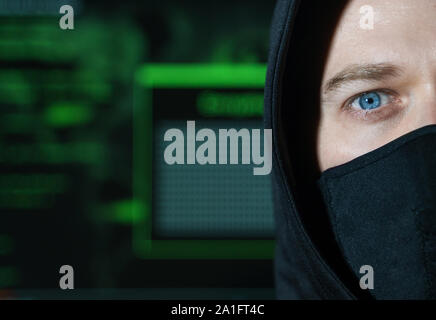 Hacker in schwarze Maske. Hacking und Internet Security Konzept. Stockfoto
