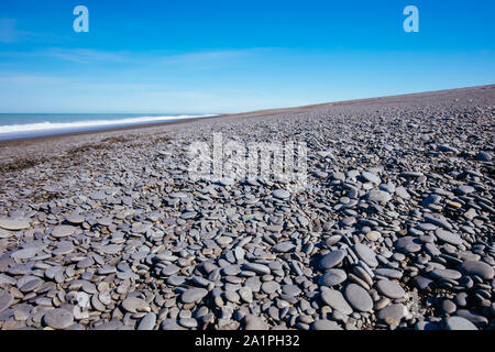 Birdlings flachen Strand an einem sonnigen Tag in Neuseeland Stockfoto