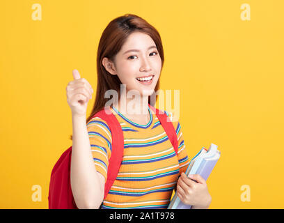 Portrait von schöne asiatische Studenten holding Bücher Stockfoto