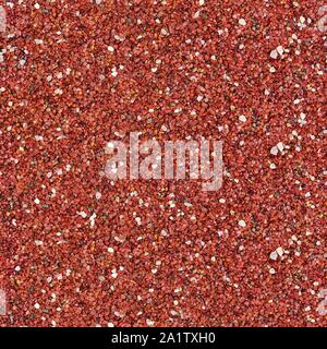 Oberfläche mit kleinen roten Steinen bedeckt. Nahtlose square Textur. Fliese bereit. Stockfoto