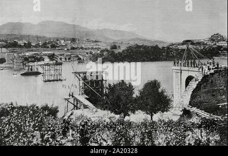 España. Galizien. Estado de Pontevedra. Puente Internacional de Tui sobre el Río Miño. Construido en piedra y Metall en el año 1884 e inagurado En 1885. Estado de las Obras de Fàbrica al comenzarse la construcción de Las Pilas. Grabado por Bernardo Rico (1825-1894). La ilustración Española y Americana, 8 de marzo de 1884. Stockfoto