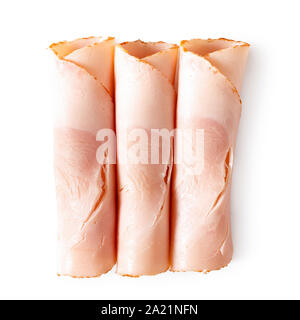Drei aufgerollt Scheiben Huhn Schinken isoliert auf Weiss. Ansicht von oben. Stockfoto