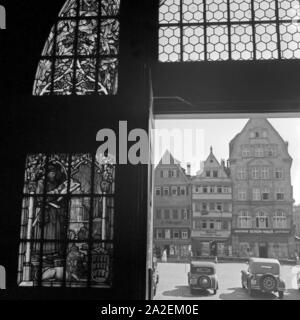 Blick aus einem Fenster in das schuhhaus Bletzinger J. und das Haus C.F. Benger in Stuttgart, Deutschland, 1930er Jahre. Blick aus dem Fenster zu schuhhaus Bletzinger und C.F. Benger's House in Stuttgart, Deutschland 1930. Stockfoto