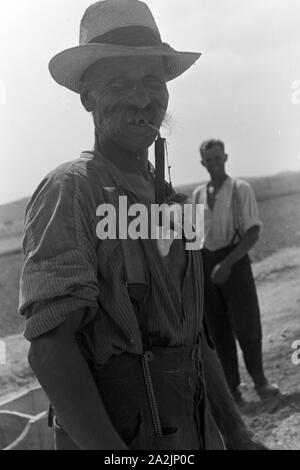 Männer bei der Arbeit, Deutsches Reich 30er Jahre. Männer an der Arbeit, Deutschland 1930. Stockfoto