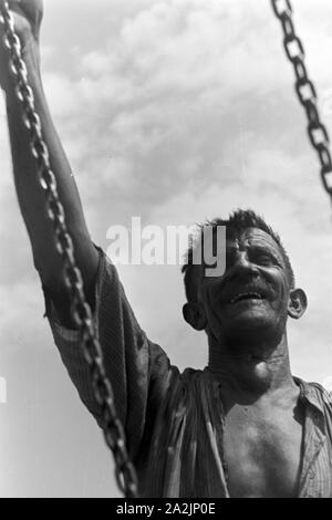 Männer bei der Arbeit, Deutsches Reich 30er Jahre. Männer an der Arbeit, Deutschland 1930. Stockfoto