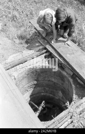 Ein mit Erdgas befeuerter Haushalt, Deutsches Reich 30er Jahre. Ein Gas beleuchteten Haushalt, Deutschland 1930. Stockfoto