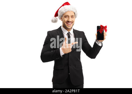 Unternehmer tragen ein Weihnachtsmann hat zeigt auf einem Mobiltelefon auf weißem Hintergrund Stockfoto