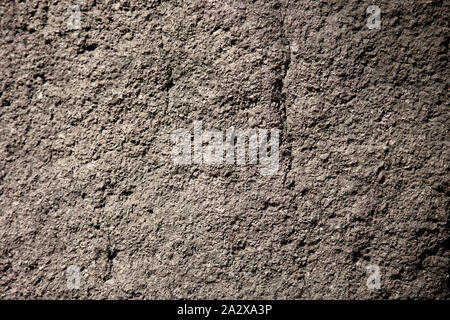 Scabrous grau Naturstein oder Stein -Textur Hintergrund. Stockfoto