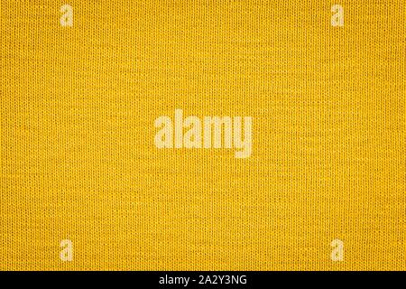 Textur von echten gelben Pullover, Textil- Hintergrund. Zusammenfassung Hintergrund Stockfoto