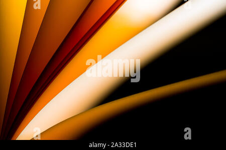 Helles orange beleuchtete Notepad in verschiedenen Position und Arrangements abstract für Hintergrund und Tapeten Stockfoto