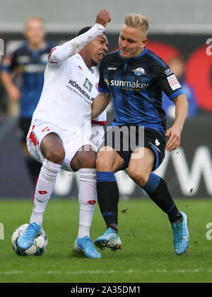 Paderborn, Deutschland. 05 Okt, 2019. Fussball: Bundesliga, SC Paderborn 07 - 1.FSV Mainz 05, 7.Spieltag in der Benteler Arena. Paderborner Kai Pröger (r) im Kampf um den Ball mit Jean-Paul Boetius (l) aus Mainz. Credit: Friso Gentsch/dpa - WICHTIGER HINWEIS: In Übereinstimmung mit den Anforderungen der DFL Deutsche Fußball Liga oder der DFB Deutscher Fußball-Bund ist es untersagt, zu verwenden oder verwendet Fotos im Stadion und/oder das Spiel in Form von Bildern und/oder Videos - wie Foto Sequenzen getroffen haben./dpa/Alamy leben Nachrichten Stockfoto