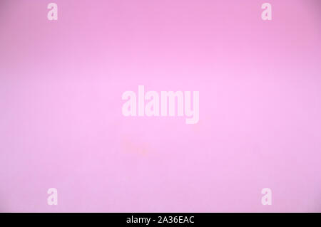 Foto einer unfocused Rosa strukturierten Hintergrund mit violetten Reflexen Stockfoto