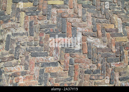 Pflastersteine aus alten Stein von regelmäßiger Form. Steinboden Textur, Hintergrund Stockfoto