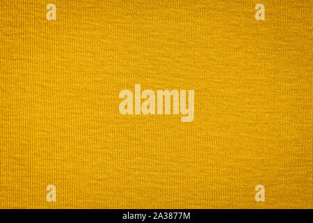 Textur von echten gelben Pullover, Textil- Hintergrund. Zusammenfassung Hintergrund Stockfoto