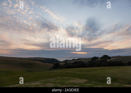 Sonnenuntergang über Hoffnung Cove, Devon, England, Vereinigtes Königreich. Stockfoto