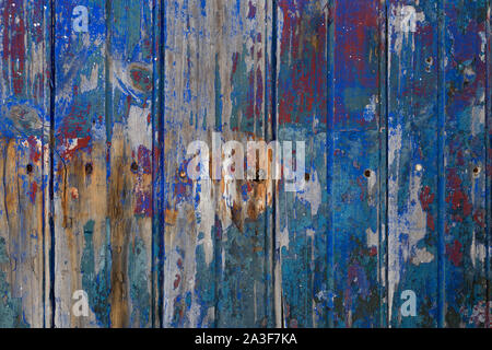 Alte hölzerne grungy texturierte Zaun mit gebrochenen Farben full frame Stockfoto