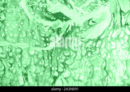 Zusammenfassung Hintergrund mit fluid Technik in Hellgrün mint Farbe. Trendig bunten Hintergrund Stockfoto