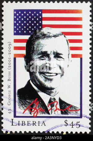 Präsident George Bush jr. und Flagge auf Briefmarke Stockfoto
