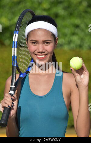 Tennis Player und Glück mit Tennisschläger Stockfoto