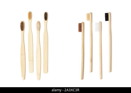 Vier umweltfreundliche Bambus Zahnbürsten auf zwei Arten auf dem weißen Hintergrund isoliert. Null Abfall Konzept, Kunststoff, organische, eco-friendly Shopping Stockfoto