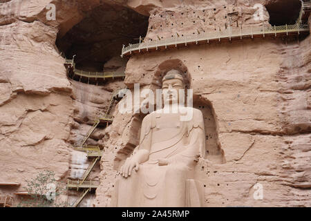 Alte chinesische Buddha Statue an Anja Höhlentempel in Lanzhou Gansu Chinas. Weltkulturerbe der UNESCO Stockfoto