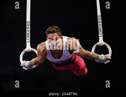 Stuttgart, Deutschland. 12 Okt, 2019. Ibrahim Colak der Türkei konkurriert während der Herren Ringe Finale bei den 2019 Abb. Gymnastics World Championships in Stuttgart, Deutschland, 12.10.2019. Credit: Lu Yang/Xinhua/Alamy leben Nachrichten Stockfoto