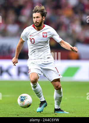 Warschau, Polen. 13 Okt, 2019. Grzegorz Krychowiak Polens konkurriert während der UEFA EURO 2020 Qualifikation Gruppe G Match zwischen Polen und Mazedonien in Warschau, Polen, Okt. 13, 2019. Credit: Rafal Rusek/Xinhua/Alamy leben Nachrichten Stockfoto