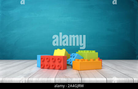 3D-Rendering von einem Spielzeug Bausteine in einem bunten Haufen Lügen über einen Schreibtisch aus Holz auf einem blauen Hintergrund. Stockfoto