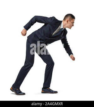 Unternehmer in voller Höhe im Profil, Biegen, geradeaus auf den weißen Hintergrund. Stockfoto