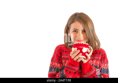 Schöne gril gekleidet wie Santa mit einer Tasse Tee in der Hand Stockfoto