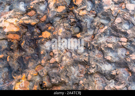 Textur von Eruptivgestein mit unebener Oberfläche Stockfoto