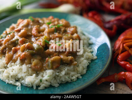 Langusten étouffée auf einem Bett aus Reis. Stockfoto