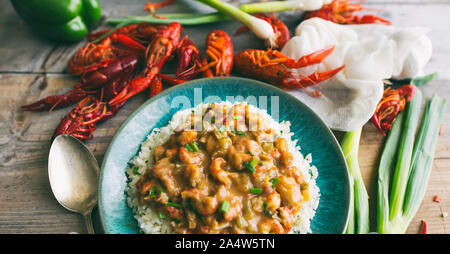 Langusten étouffée auf einem Bett aus Reis. Stockfoto