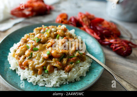 Langusten étouffée auf einem Bett aus Reis. Stockfoto