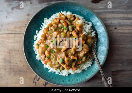 Langusten étouffée auf einem Bett aus Reis. Stockfoto